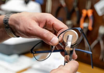 lens-glasses-making-special-workshop-close-up-optometrist-using-special-tools-equipment (1)