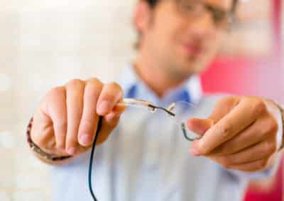 Young man at optician with glasses